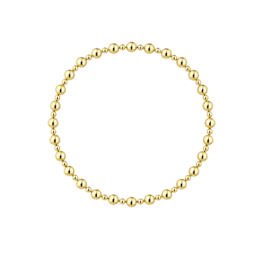 A gold beaded bracelet arranged in a neat circle on a solid white background.