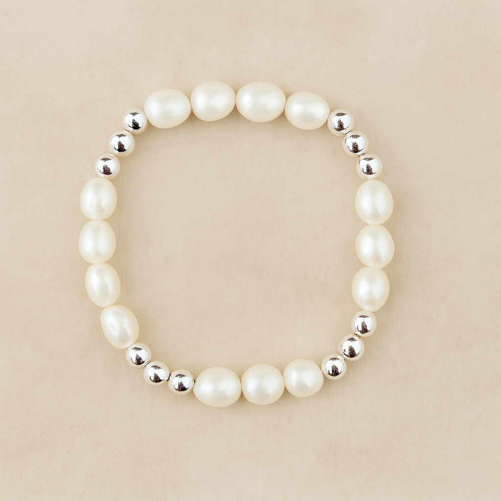 Pearl bracelet with silver beads on a beige background