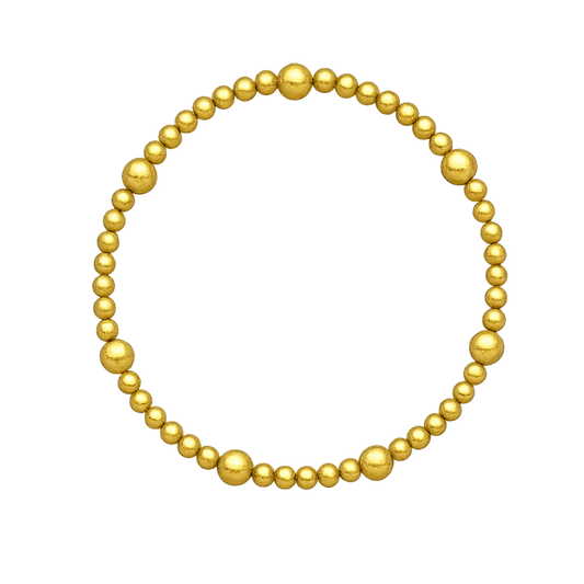 Gold beaded bracelet on a white background