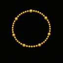 Gold beaded bracelet on a black background