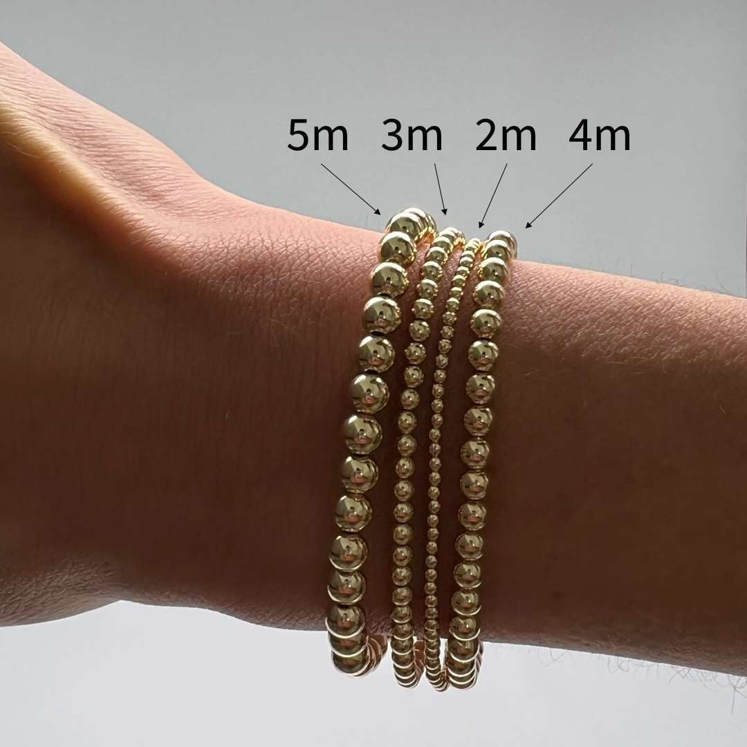 comparison of 2mm 3mm 4mm and 5mm gold ball bracelets